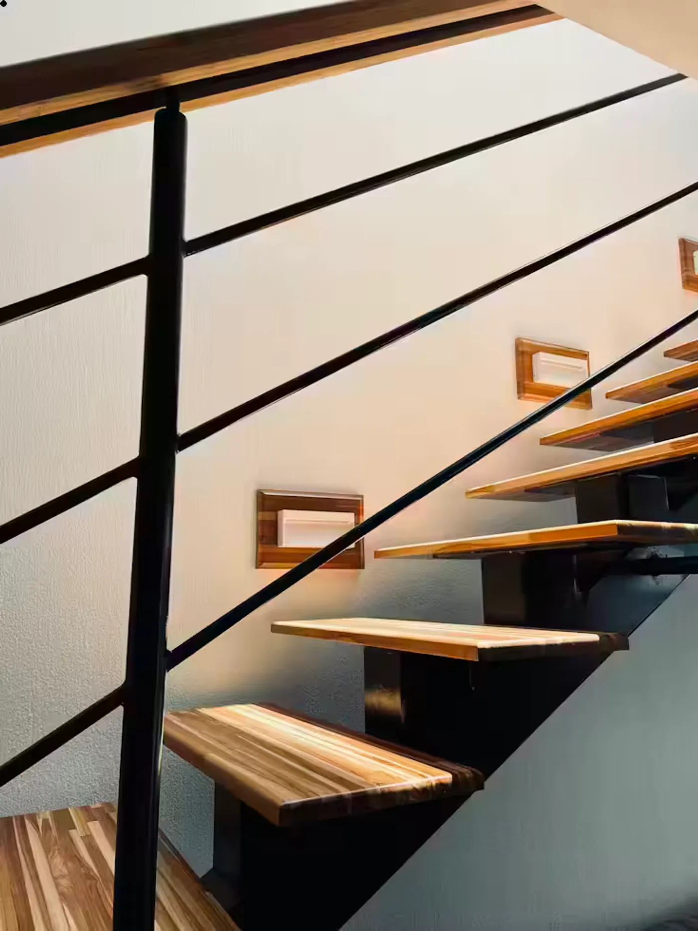 Custom glass balustrade railing system on a floating staircase in NYC